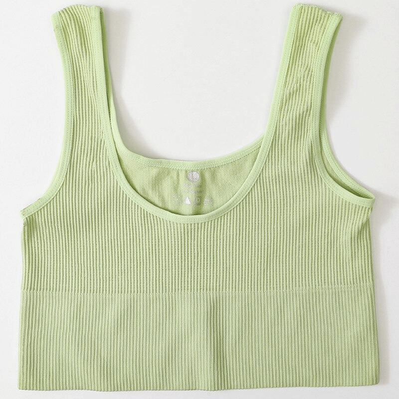 Light green ribbed seamless tank top for women, perfect for yoga and fitness, made from nylon and spandex. Designed for comfort and movement.